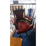 A 1920's oak office swivel chair