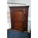 A small oak corner cabinet, 71.5cm wide