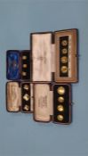 Four sets of cased gold stud sets, various carats