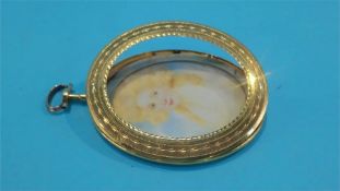 An oval Georgian miniature in the style of Paul Cosway, in ornate 22ct gold frame, makers mark