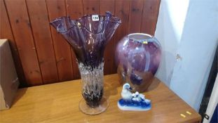 Two glass vases and a Delft figure group