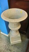 A garden urn and stand