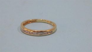 An 18ct sixteen stone eternity ring, approx.. .3ct