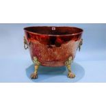 A copper and brass oval two handled log bin