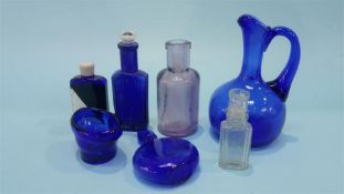 Assorted blue glass bottles