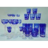 A suite of blue flashed glassware