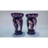 A pair of Royal Doulton 'Morrisian' vases on a blue ground, decorated with dancing girls, numbered