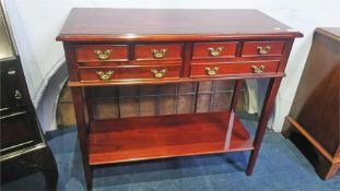 A reproduction mahogany side table with six drawers, 82cm wide