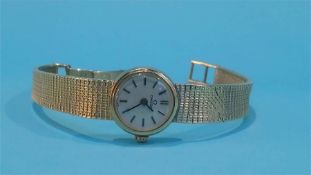 A Ladies 9ct gold Omega wrist watch with circular dial, total weight 19.7 grams