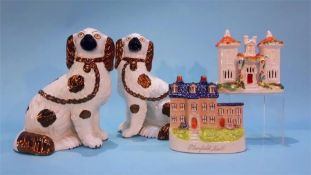 A pair of Staffordshire Spaniels and two cottages