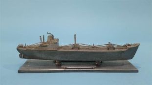 A cast pewter paperweight, modelled as an SD14 ship