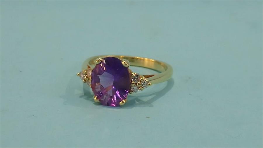 An 18ct diamond and amethyst ring