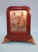 An oak cased mantel clock, with eight day movement, chiming action