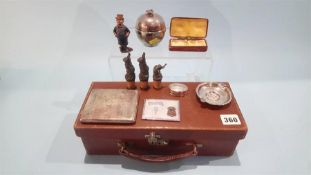 A leather case, containing a silver cigarette case, ashtray etc.
