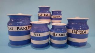 Six graduated Cornish Ware kitchen storage jars