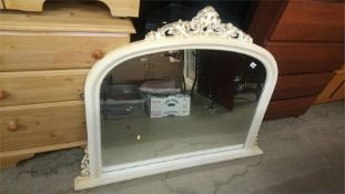 An over mantle mirror