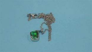 An 18ct diamond and opal pendant