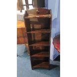 A narrow oak bookcase