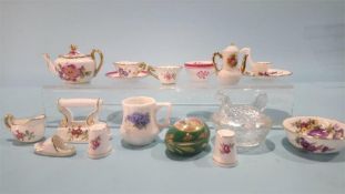 A collection of miniature porcelain items in one box