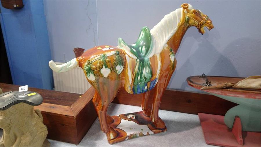 An Oriental glazed pottery horse