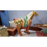An Oriental glazed pottery horse
