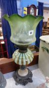 Oil lamp with green glass reservoir