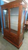 A yew wood display cabinet