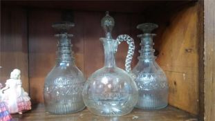 Pair of three ring decanters and one other