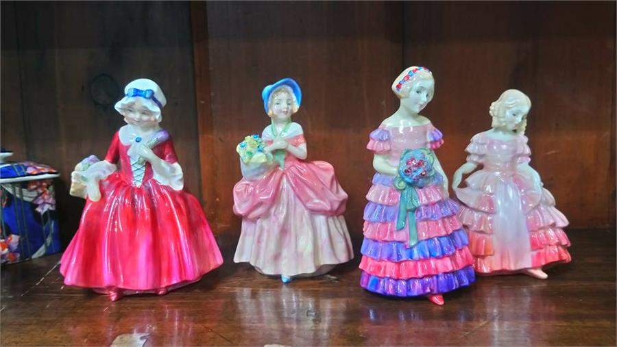 Four small Royal Doulton figures