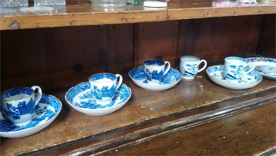 Collection of blue and white cups, saucers etc.