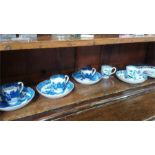 Collection of blue and white cups, saucers etc.