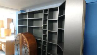 Five bookcases and a desk