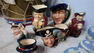 Collection of seven Royal Doulton Toby jugs