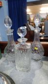 Three cut glass decanters