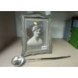 Silver picture frame and a Toddy ladle