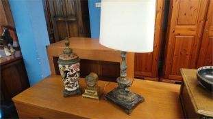 Two decorative lamps and a clock