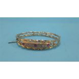 A 9ct gold bracelet, inset with diamond and rubies, weight 7.6 grams