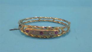 A 9ct gold bracelet, inset with diamond and rubies, weight 7.6 grams