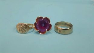 An 18ct gold flower design ring, total weight 8.8 grams and two 9ct gold rings, weight 9.4 grams