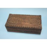 A carved wooden box, 30cm length