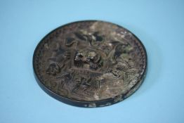 A good quality bronze Chinese hand mirror. 11cm diameter