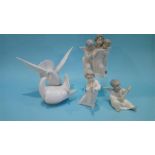 A Lladro figure of the two doves number 6291 and three Lladro angel figures