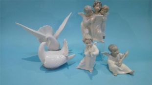 A Lladro figure of the two doves number 6291 and three Lladro angel figures