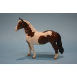 A Beswick Skewbald brown and white pony