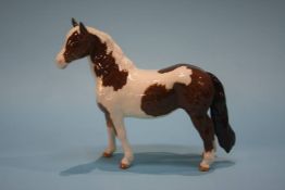 A Beswick Skewbald brown and white pony
