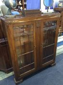 An oak Lees type china cabinet