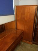 An Austin suite teak bedroom suite comprising chest of drawers, dressing table and wardrobe