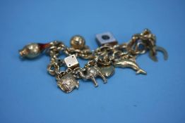 An 18ct gold charm bracelet, stamped 750, weight 20.5 grams