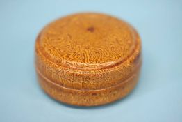 A small Chinese marbleised box and cover, possibly Tang Dynasty. 5cm diameter