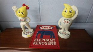 Two modern Esso money boxes and an 'Esso' sign